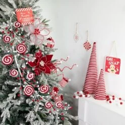 Northlight 30" Candy Cane Swirls And Pom Poms Christmas Garland
